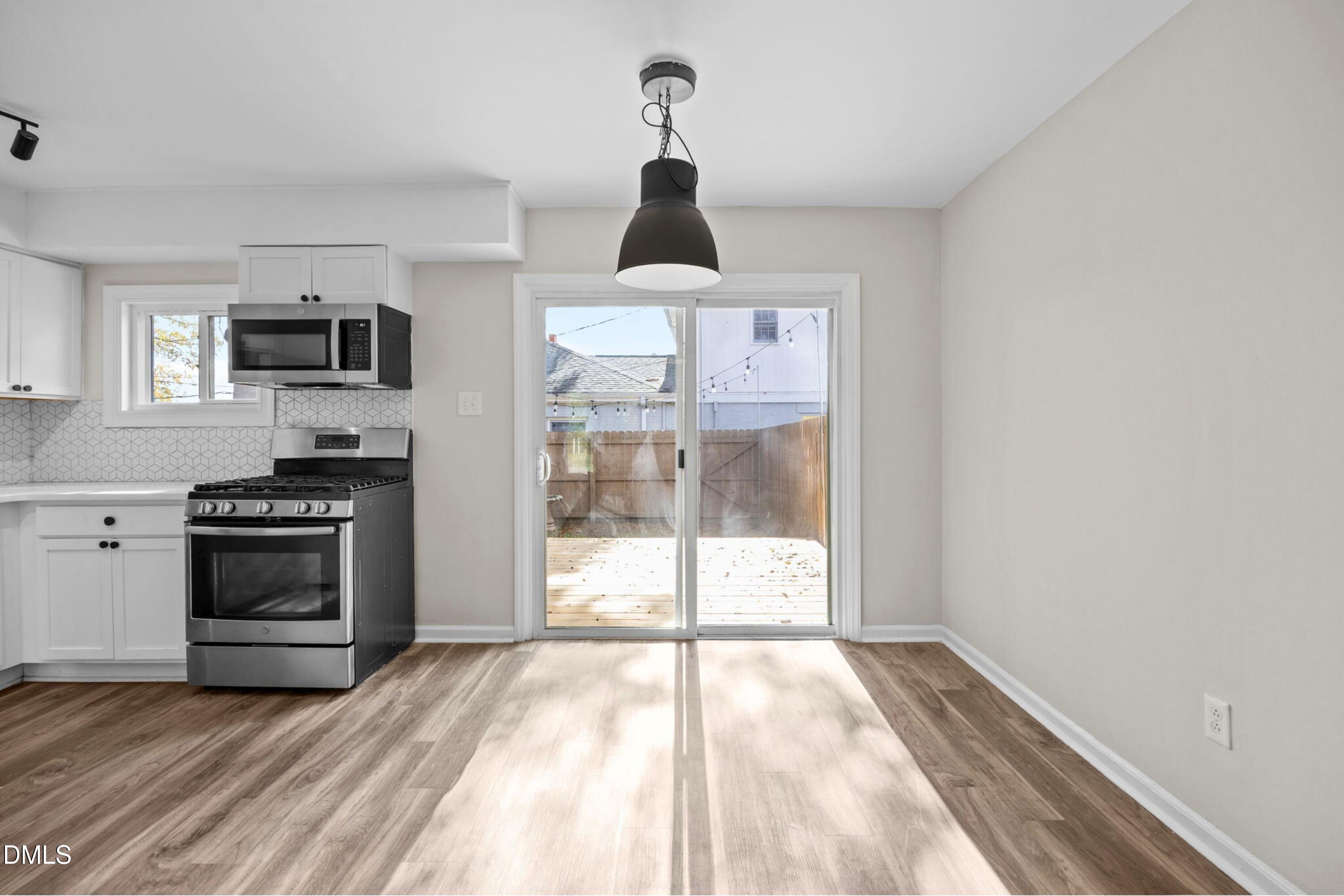 1618 Boyer Street Raleigh, NC 27610 - Photo 11 of 24 a kitchen with a stove and a refrigerator