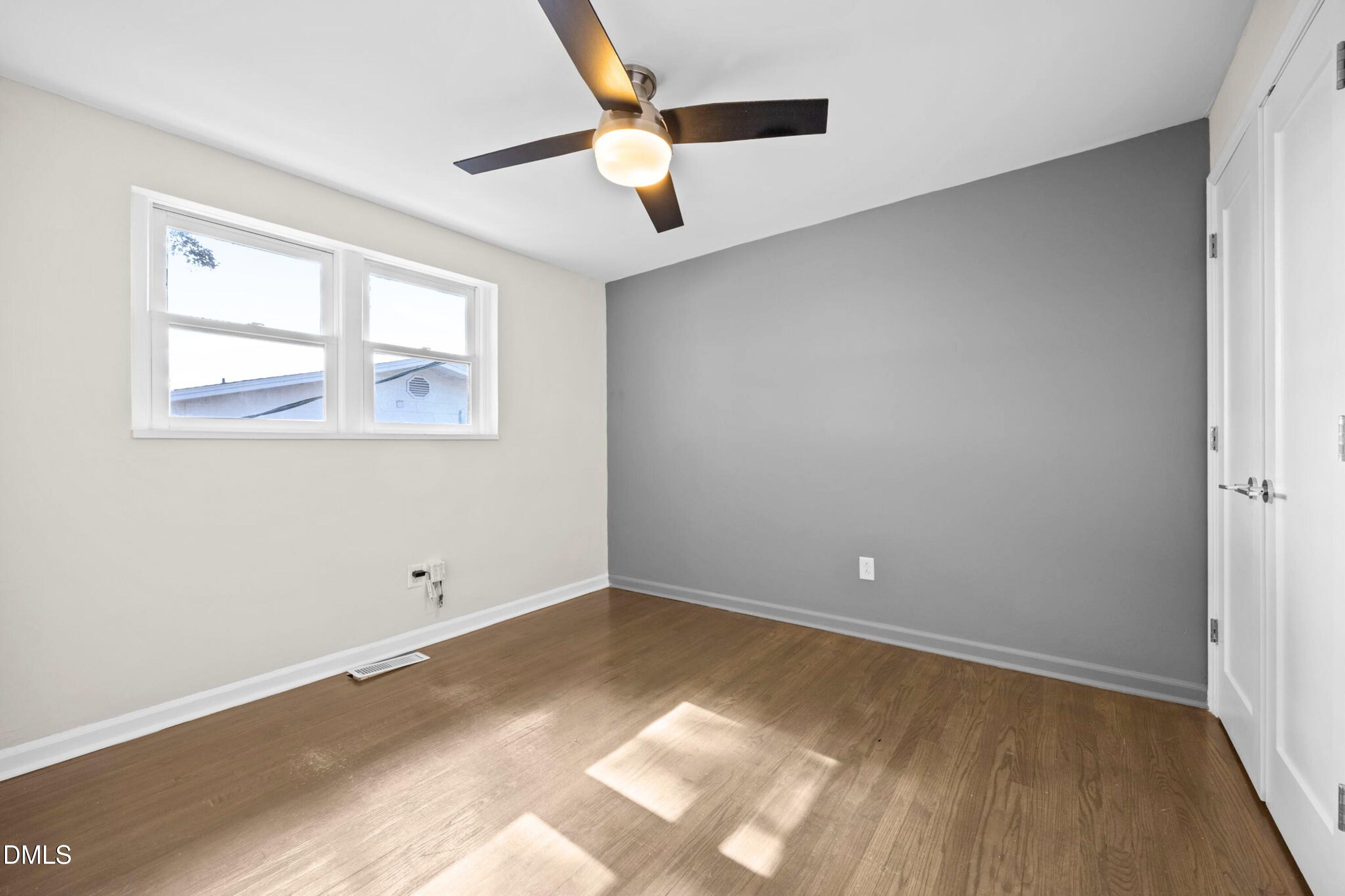 1618 Boyer Street Raleigh, NC 27610 - Photo 17 of 24 an empty room with wooden floor and windows