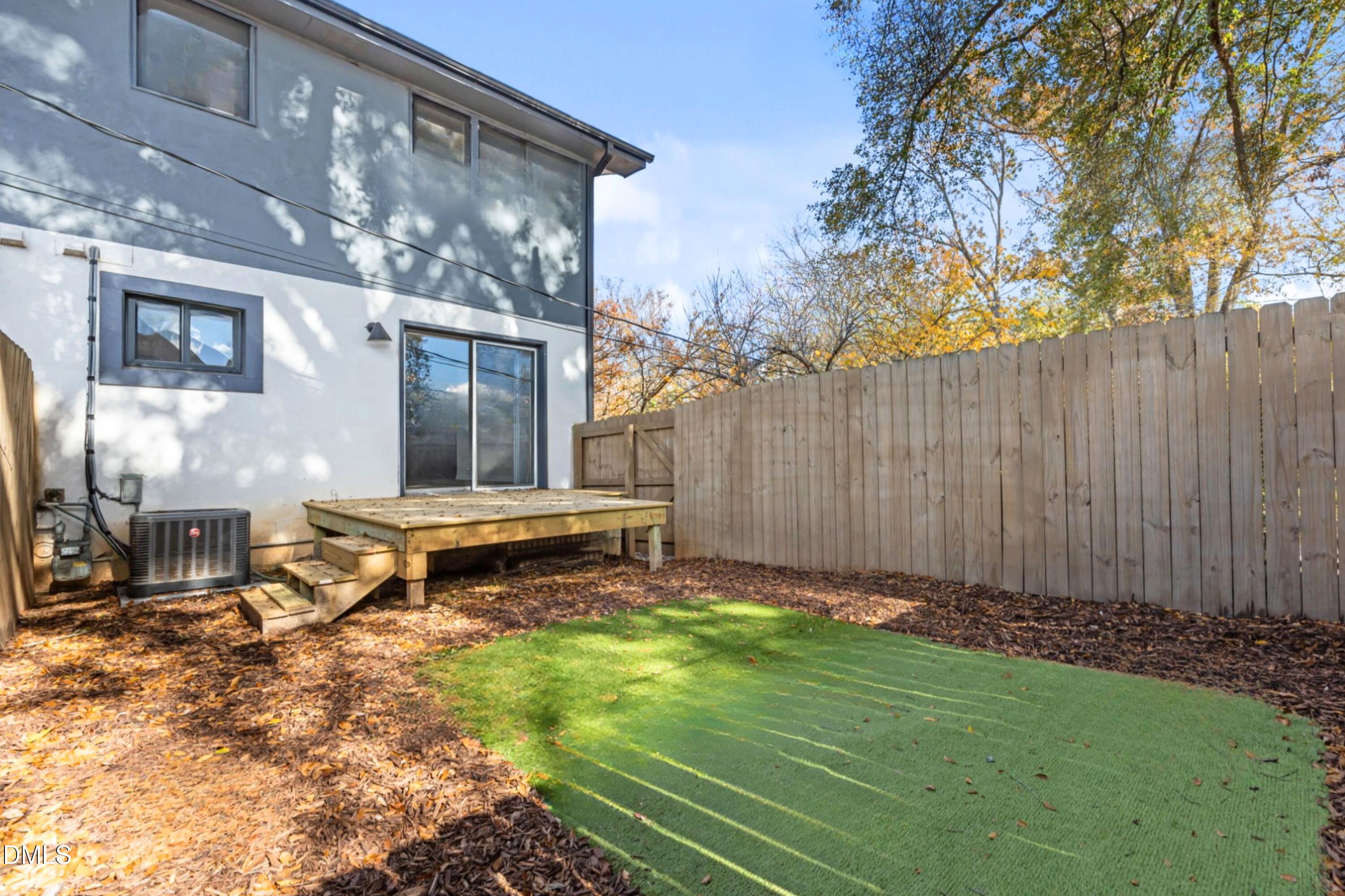 1618 Boyer Street Raleigh, NC 27610 - Photo 20 of 24 a backyard of a house with table and chairs
