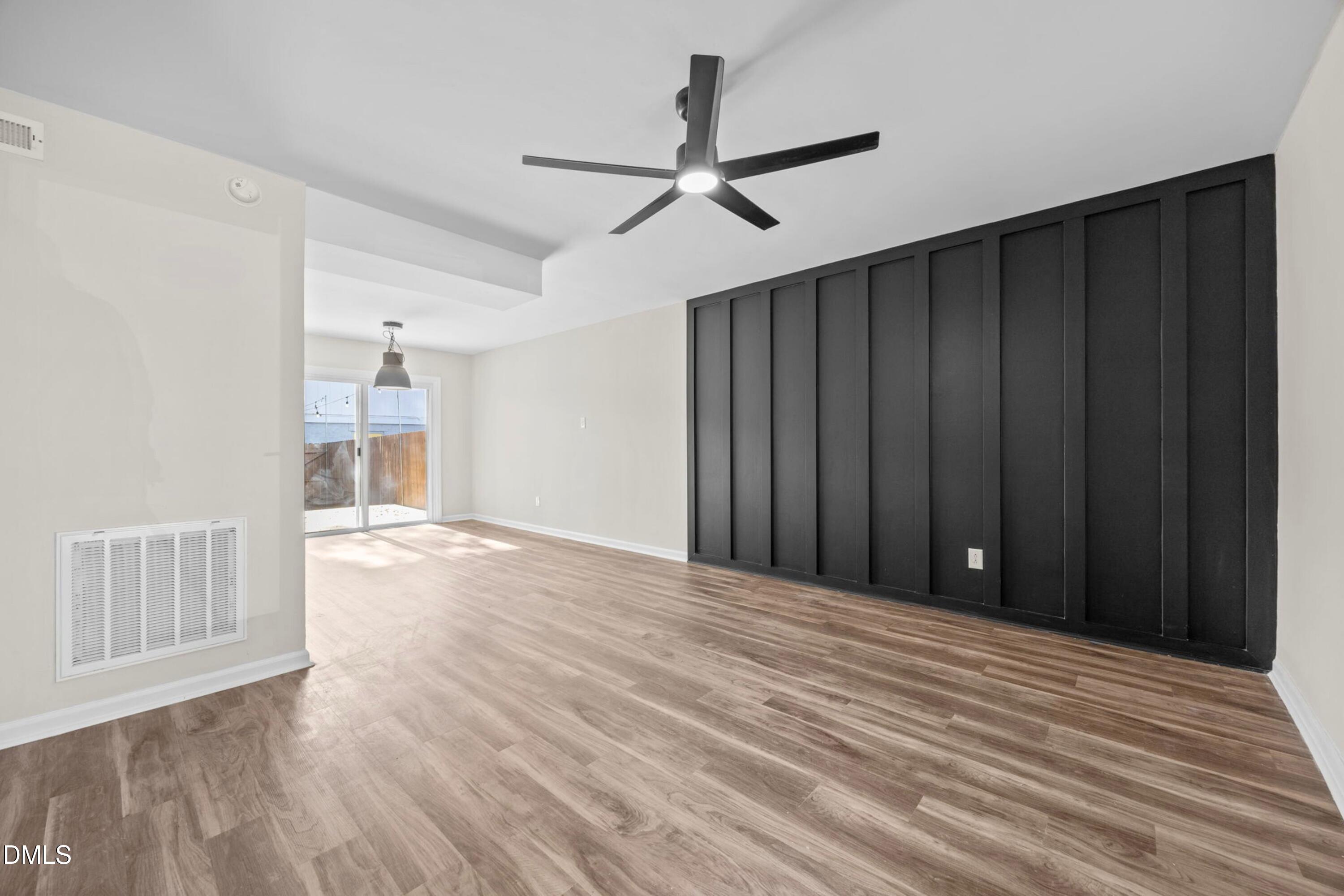 1618 Boyer Street Raleigh, NC 27610 - Photo 5 of 24 a view of an empty room with wooden floor
