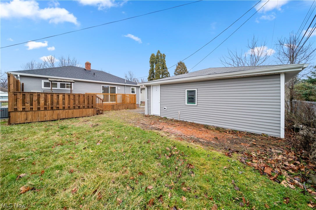 684 Sterling Road Wickliffe, OH 44092 - Photo 7 of 35 Rear view of property with a yard and a wooden deck