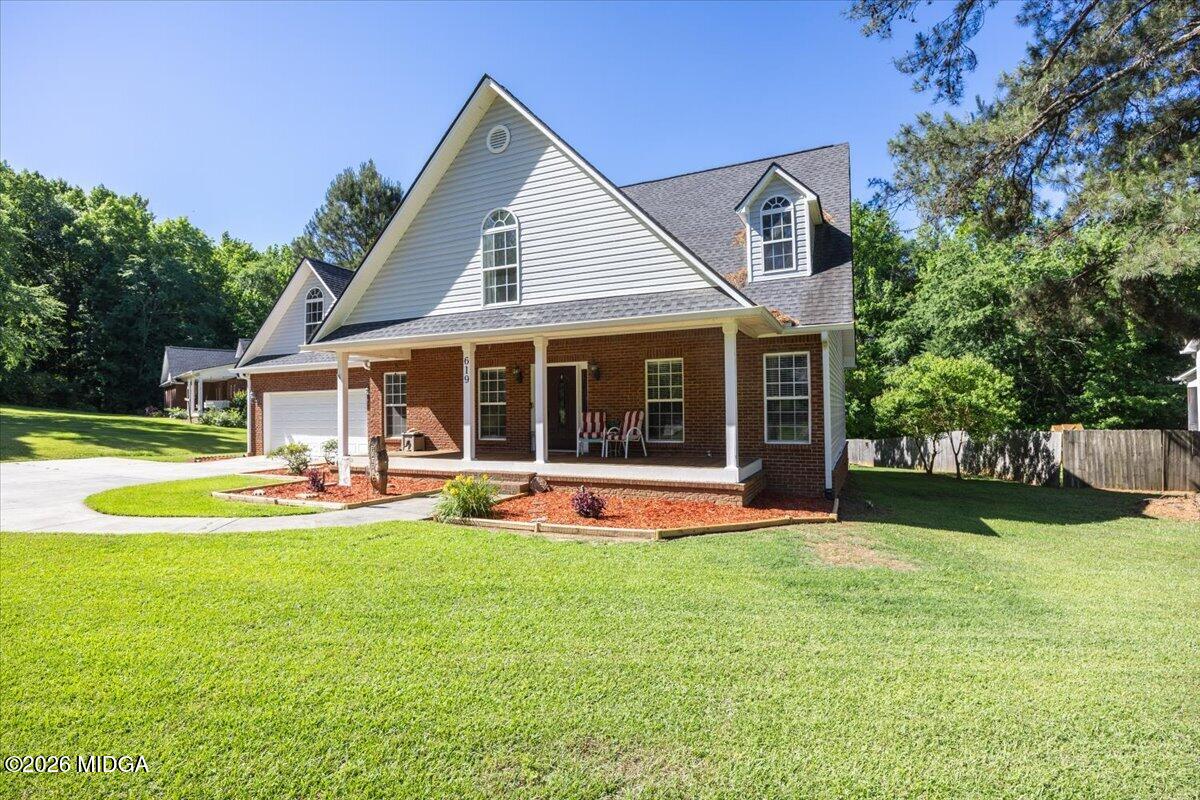 619 Grayridge Road Gray, GA 31032 - Photo 2 of 40 a view of a house with swimming pool and a yard
