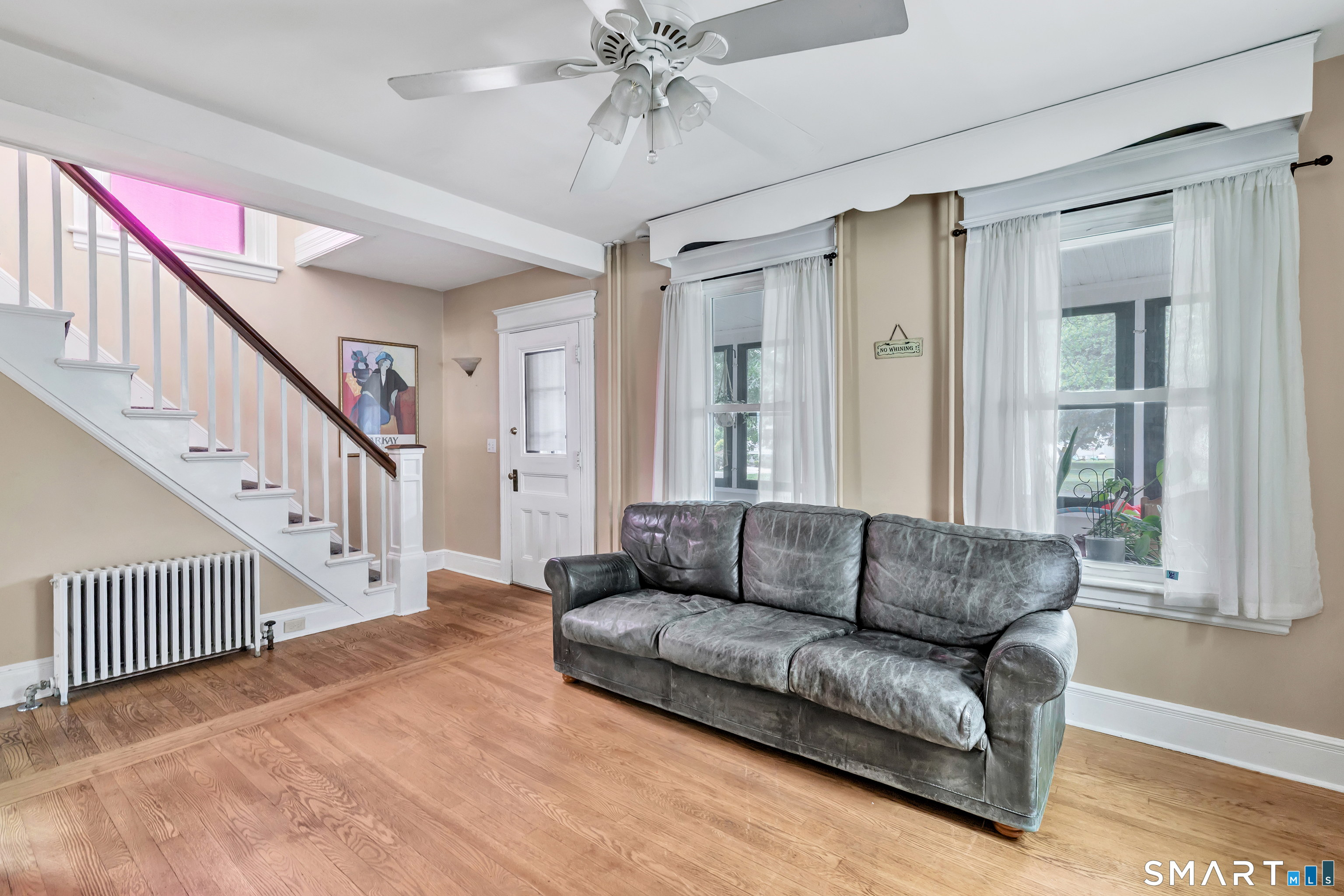 1326 Huntington Road Stratford, CT 06614 - Photo 9 of 37 Main Floor -Living Room has Hardwood Floors, lots of natural sunlight during the day.