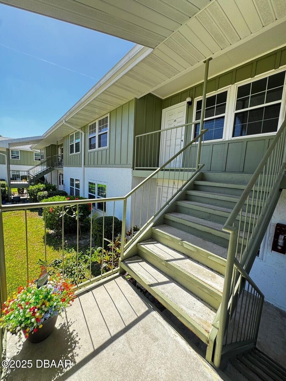 840 Center Avenue, Unit 980 Holly Hill, FL 32117 - Photo 1 of 13 a view of house with swimming pool and outdoor seating