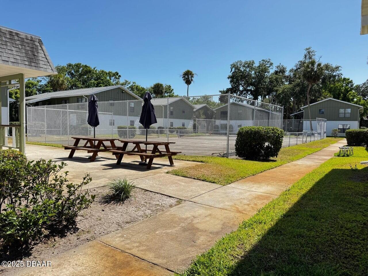 840 Center Avenue, Unit 980 Holly Hill, FL 32117 - Photo 13 of 13 a view of a swimming pool with a patio
