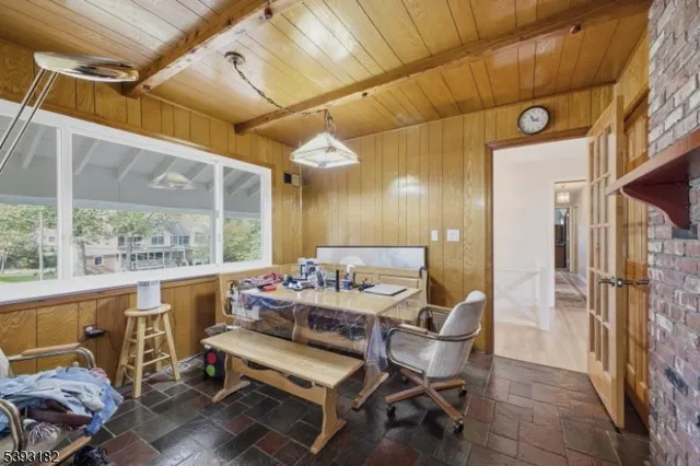 a dining room with furniture and a window