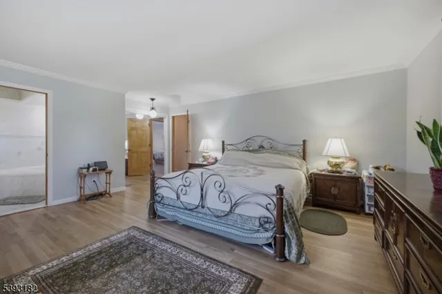 a spacious bedroom with a bed and a couch