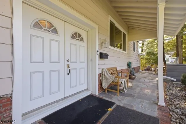 a view of two chairs in the balcony
