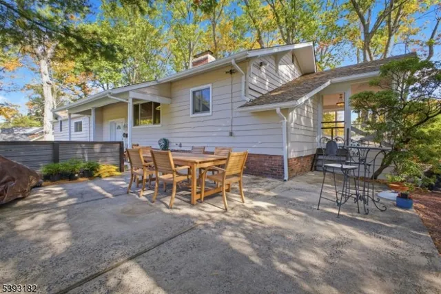 a view of a patio with table and chairs and potted plants