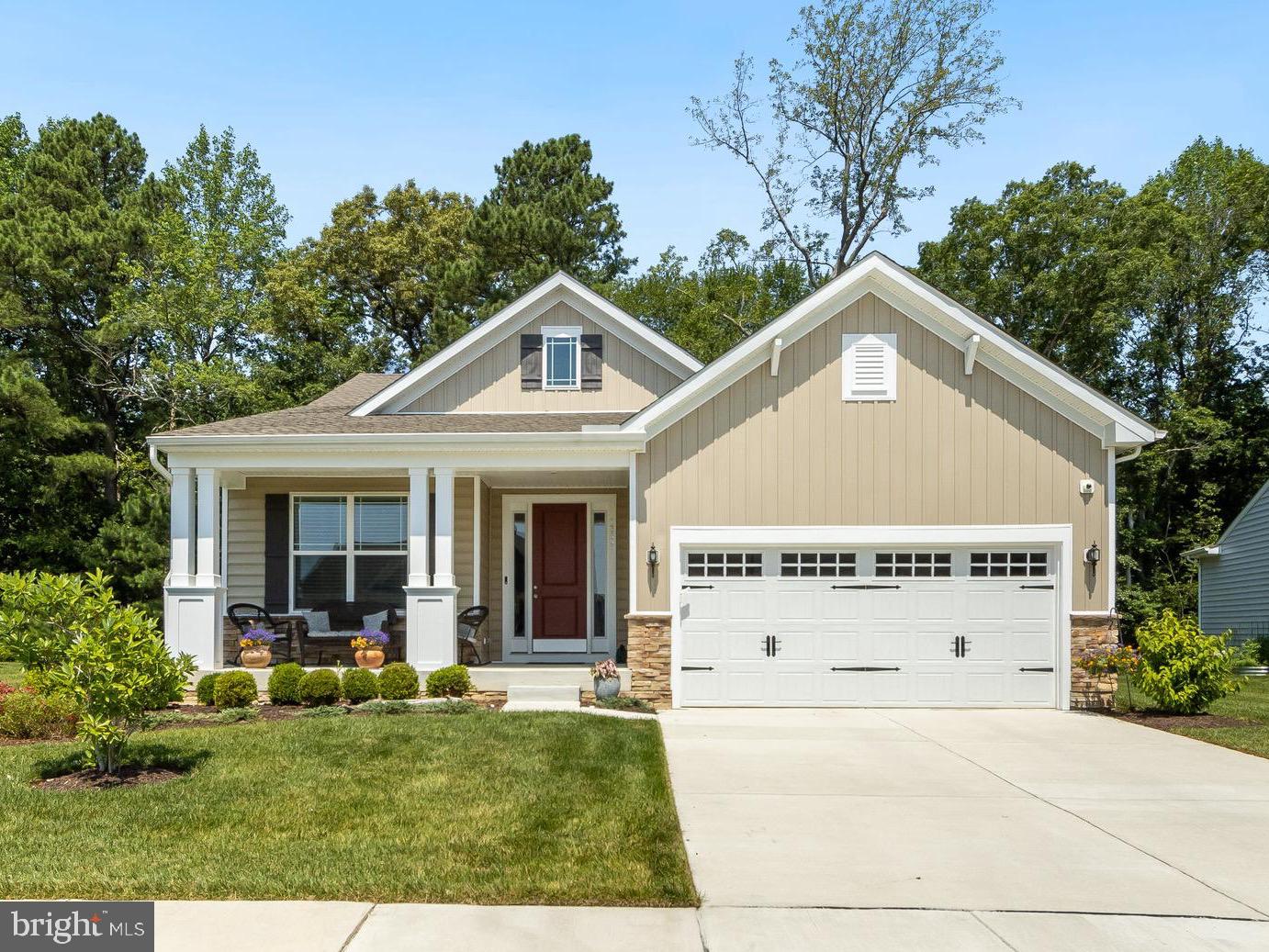 13091 Laurel Leaf Drive Lewes, DE 19958 - Photo 1 of 77 a front view of a house with a yard