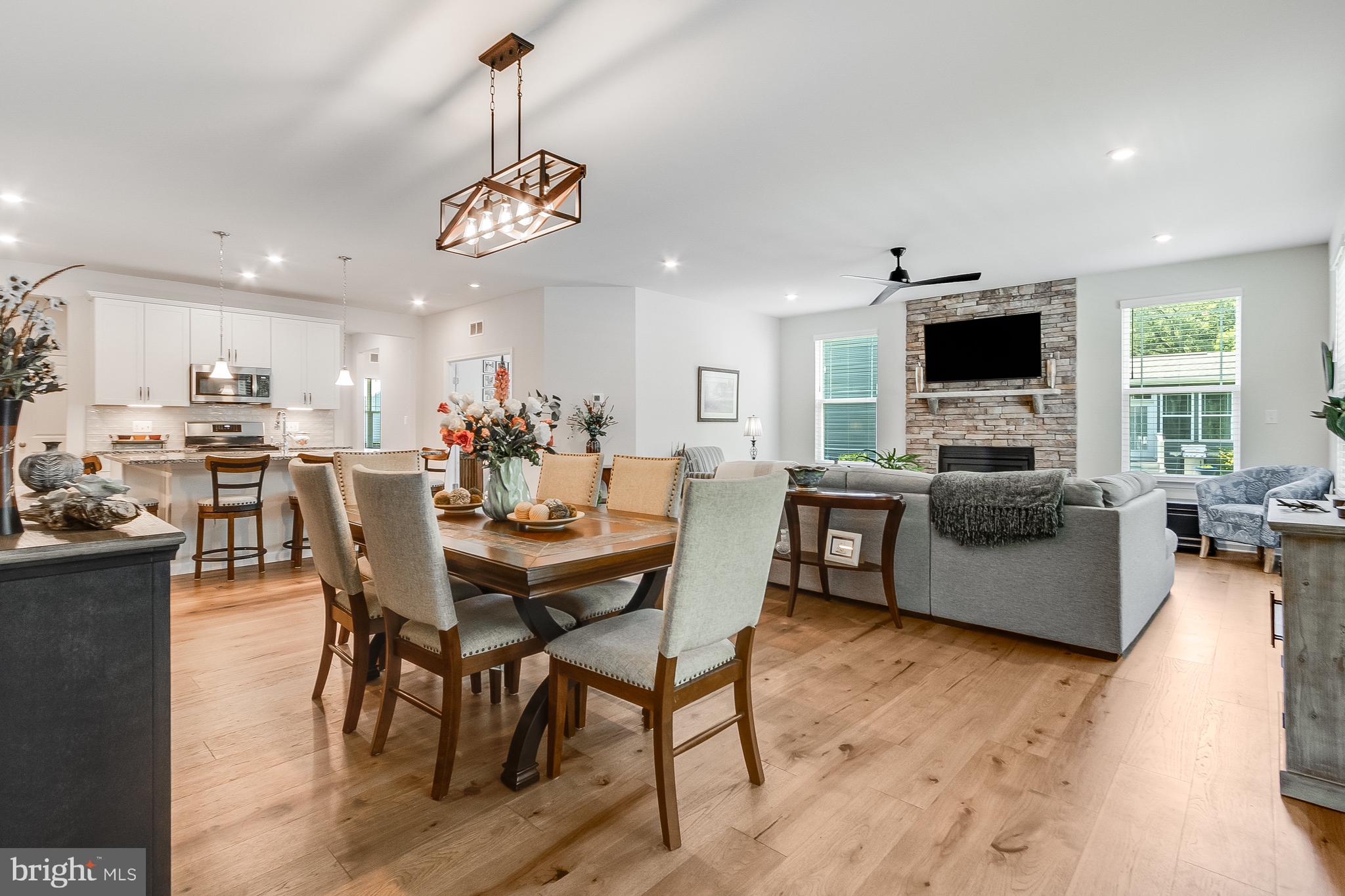 13091 Laurel Leaf Drive Lewes, DE 19958 - Photo 11 of 77 a view of a dining room with furniture window and wooden floor