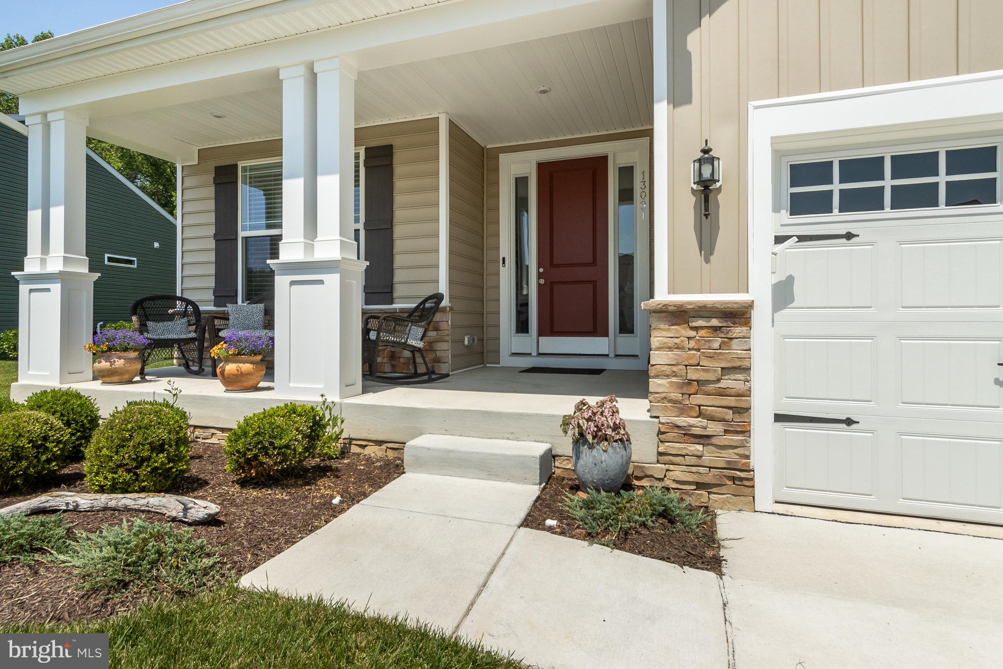 13091 Laurel Leaf Drive Lewes, DE 19958 - Photo 2 of 77 a front view of a house with a yard