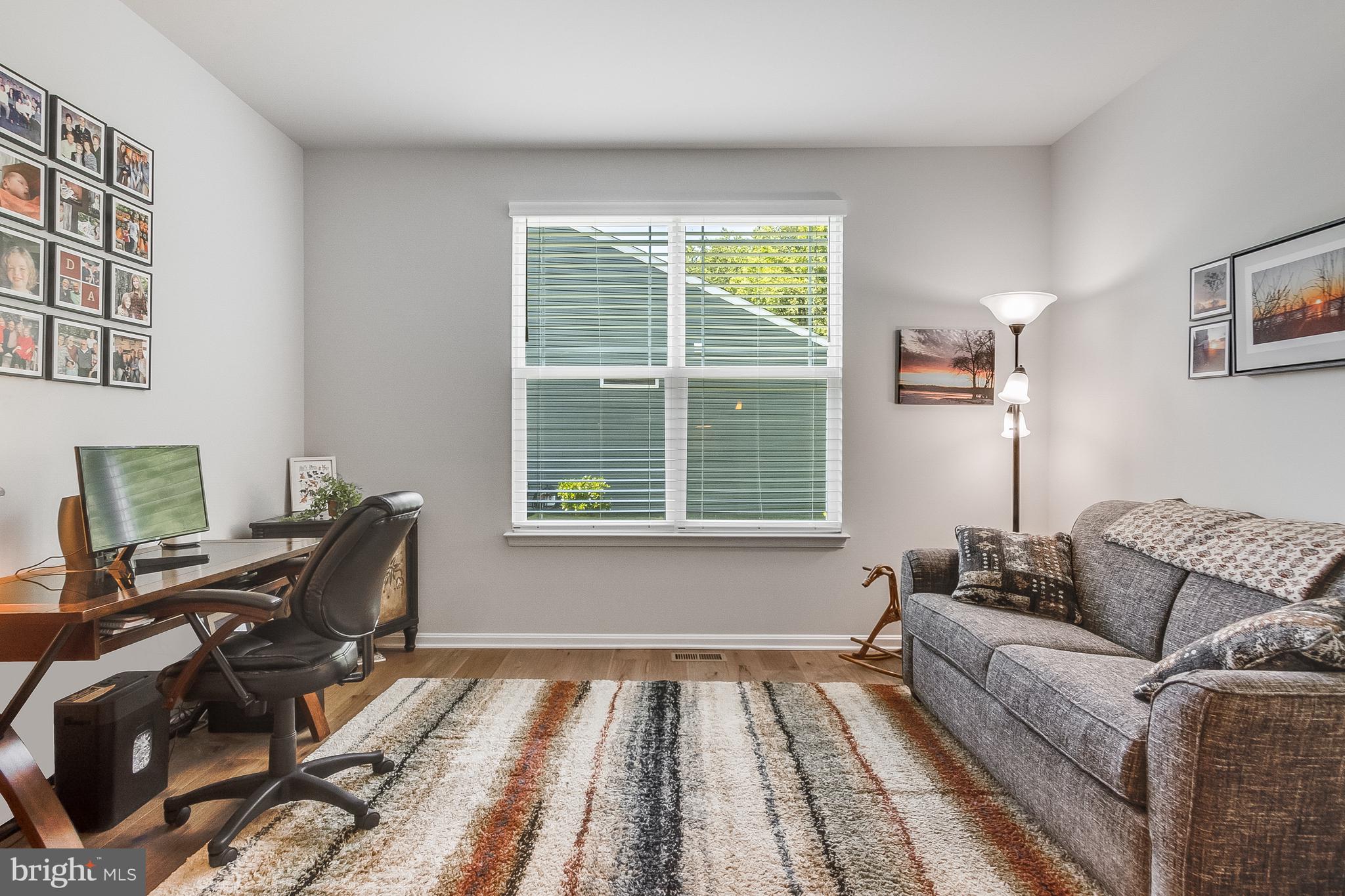 13091 Laurel Leaf Drive Lewes, DE 19958 - Photo 24 of 77 a living room with furniture and a window