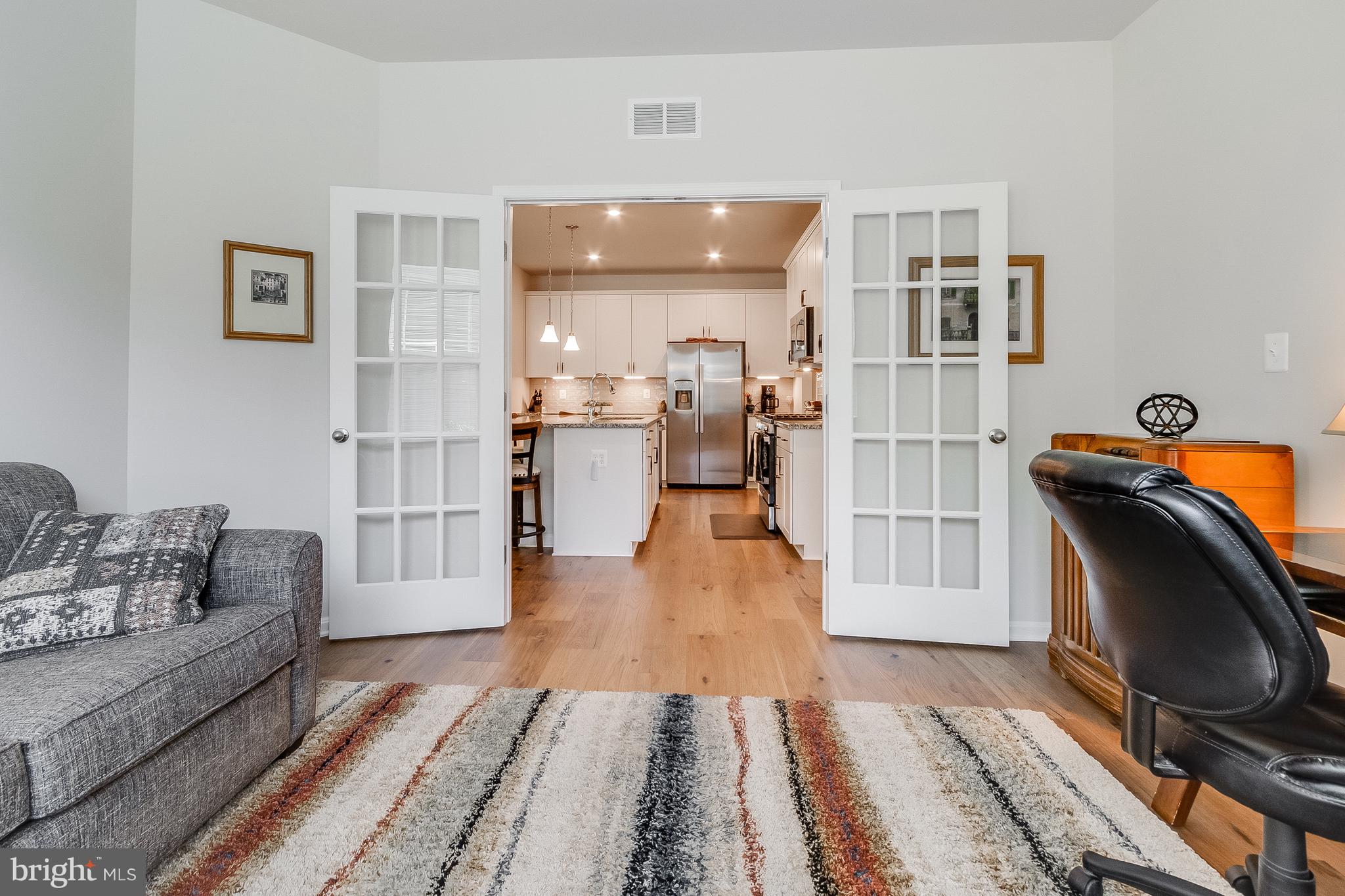13091 Laurel Leaf Drive Lewes, DE 19958 - Photo 27 of 77 a living room with furniture and a rug