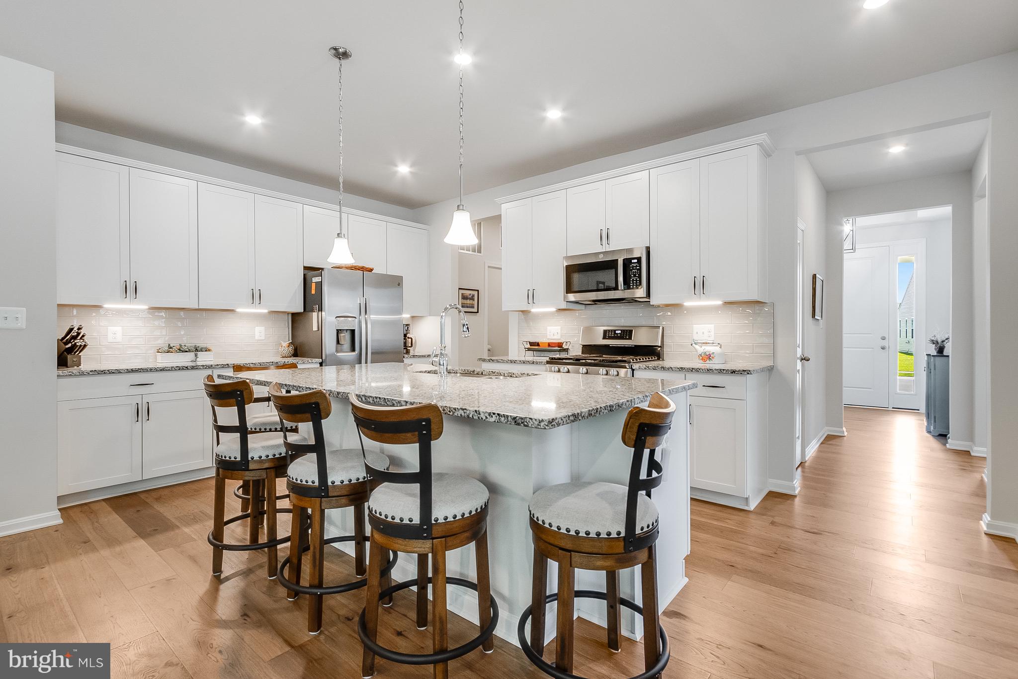 13091 Laurel Leaf Drive Lewes, DE 19958 - Photo 7 of 77 a kitchen with a table and chairs in it