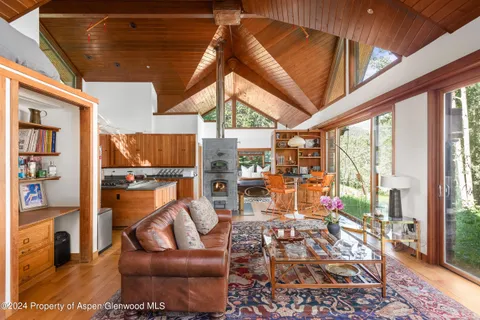a living room with lots of furniture and a rug