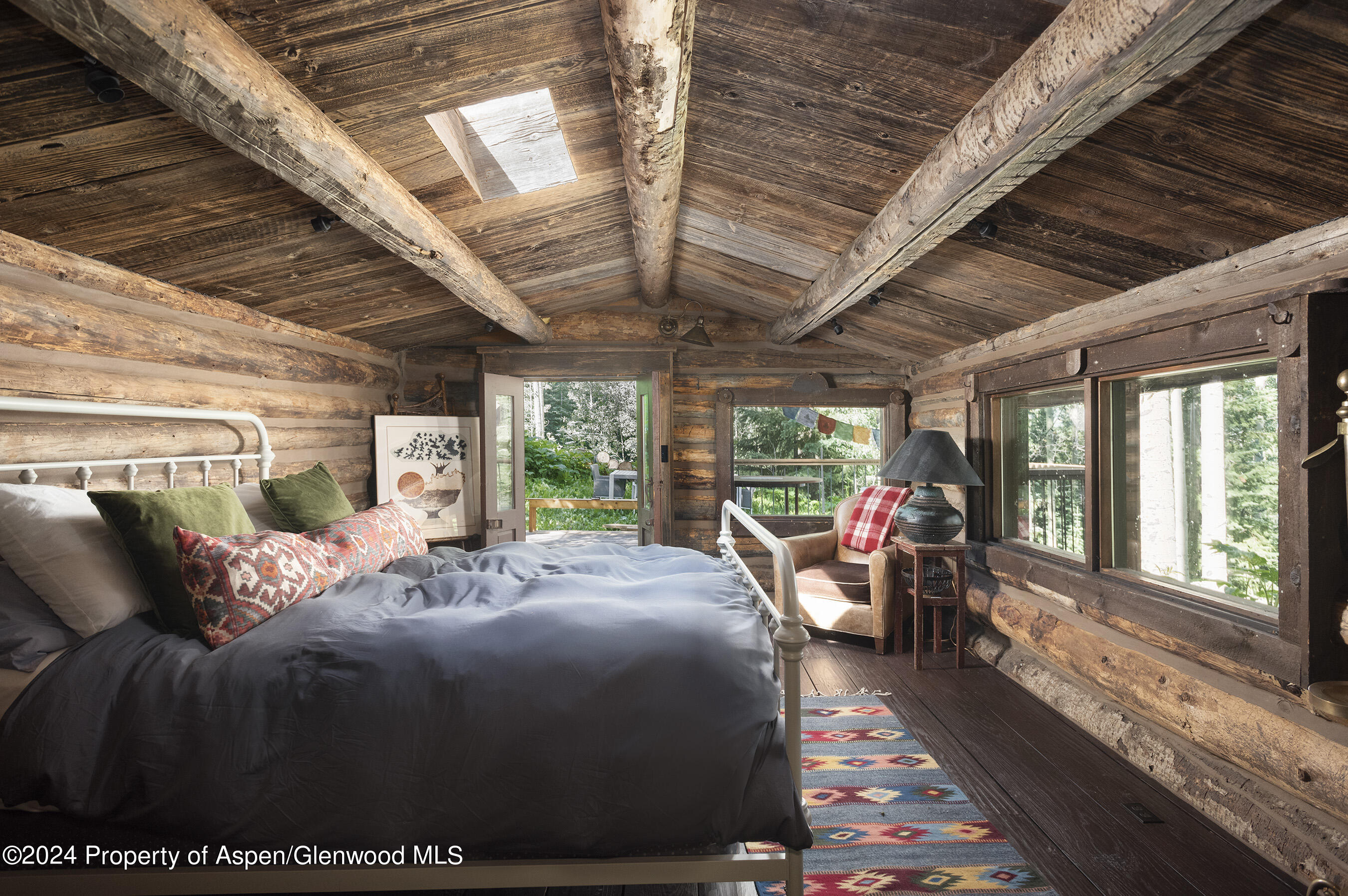 88 S Meadow Aspen, CO 81612 - Photo 33 of 40 a bed room with a bed and a large window