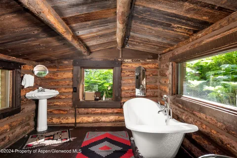 a front view of a house with garden and patio