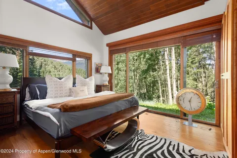 a bed room with a bed and a window