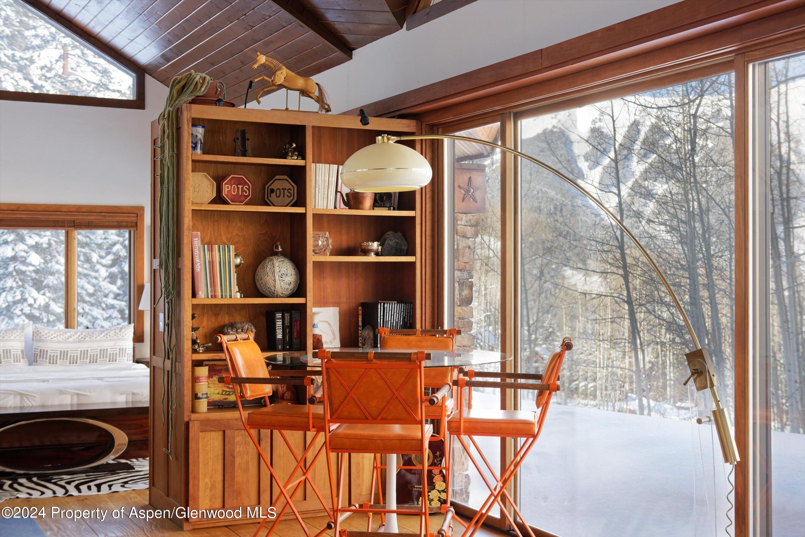 88 S Meadow Aspen, CO 81612 - Photo 5 of 40 a dining room with furniture and a floor to ceiling window