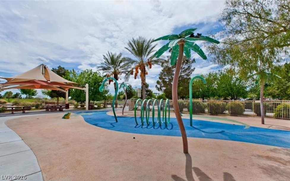 6405 North Raptor Court North Las Vegas, NV 89084 - Photo 57 of 66 Kids love this playful outdoor splash pad area, complete with shade and seating.