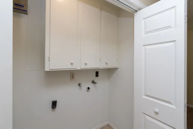 a view of wooden floor and chandelier in a room