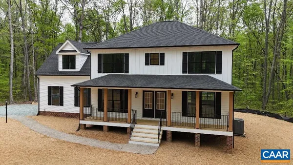 a front view of a house with a porch