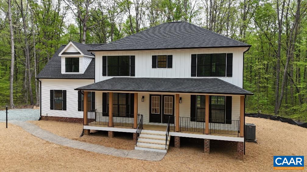 a front view of a house with a porch