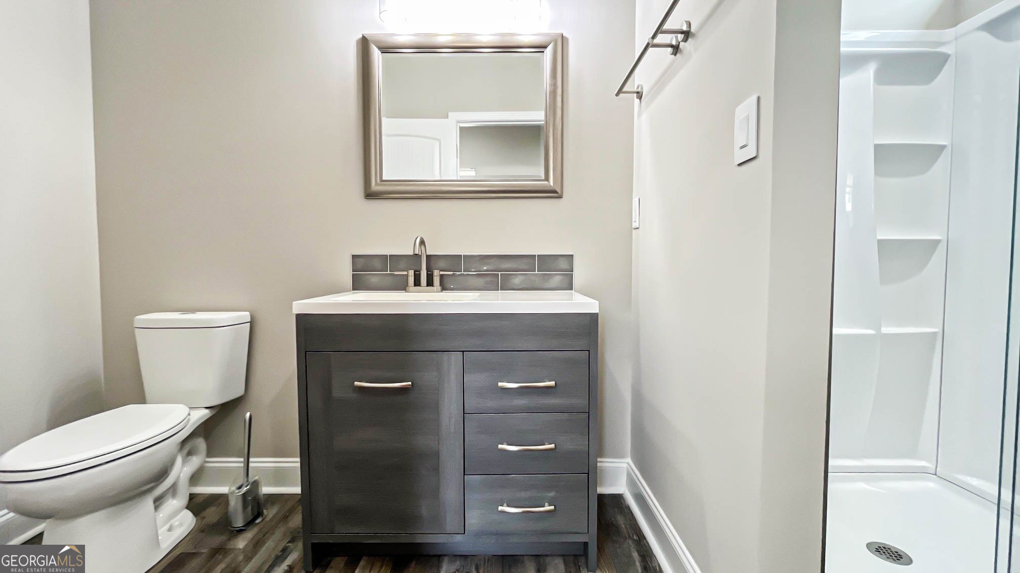 2011 Griffin Road Macon, GA 31216 - Photo 47 of 64 a bathroom with a toilet a sink and mirror
