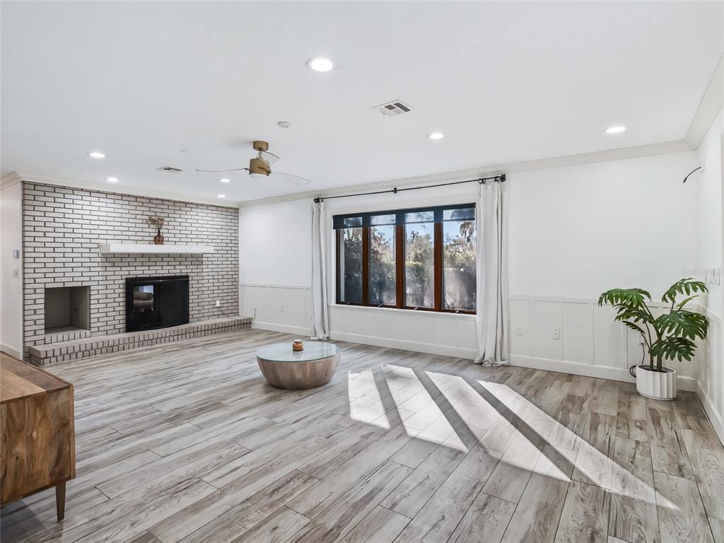 680 Southeast 123rd Street Road Ocala, FL 34480 - Photo 19 of 48 a living room with furniture and a fireplace
