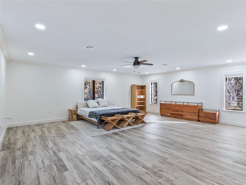 680 Southeast 123rd Street Road Ocala, FL 34480 - Photo 22 of 48 a living room with furniture and wooden floor