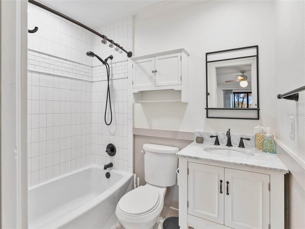 680 Southeast 123rd Street Road Ocala, FL 34480 - Photo 27 of 48 a bathroom with a sink toilet and shower