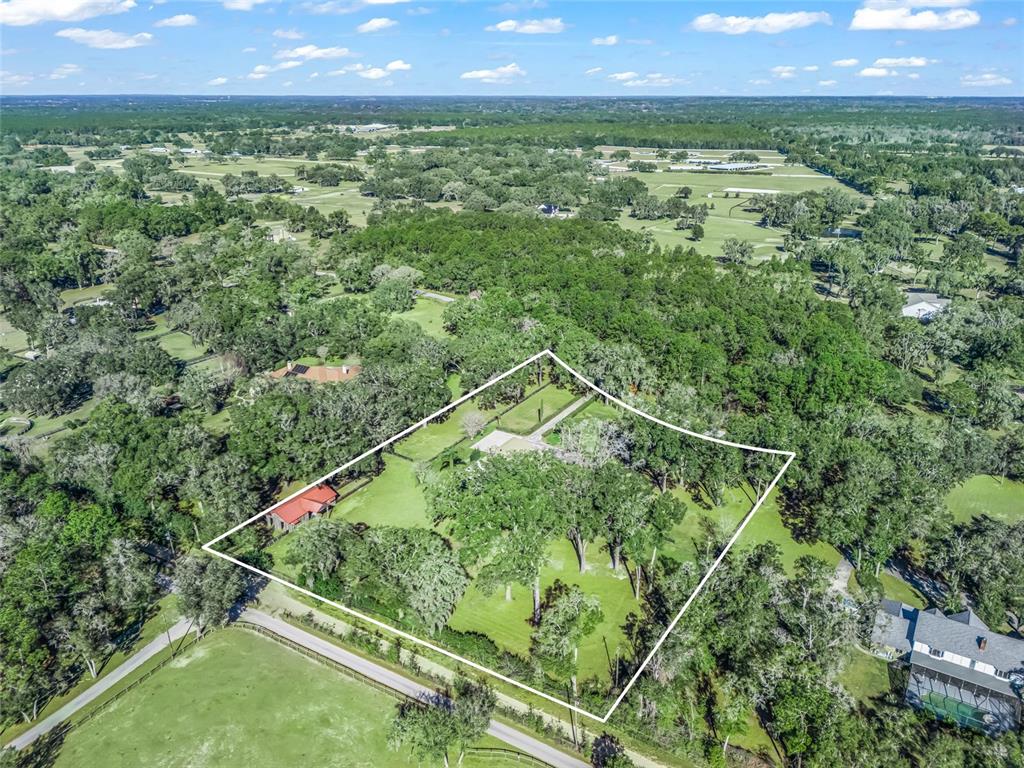 680 Southeast 123rd Street Road Ocala, FL 34480 - Photo 48 of 48 a view of a lush green field