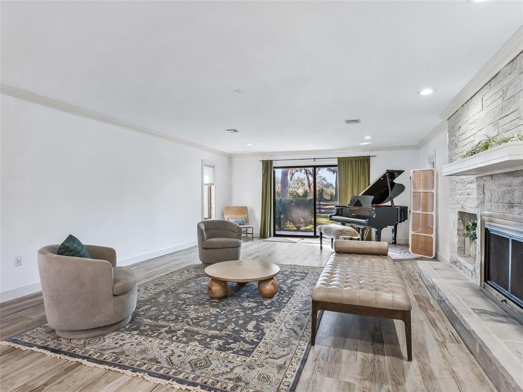 680 Southeast 123rd Street Road Ocala, FL 34480 - Photo 7 of 48 a living room with furniture and a fireplace