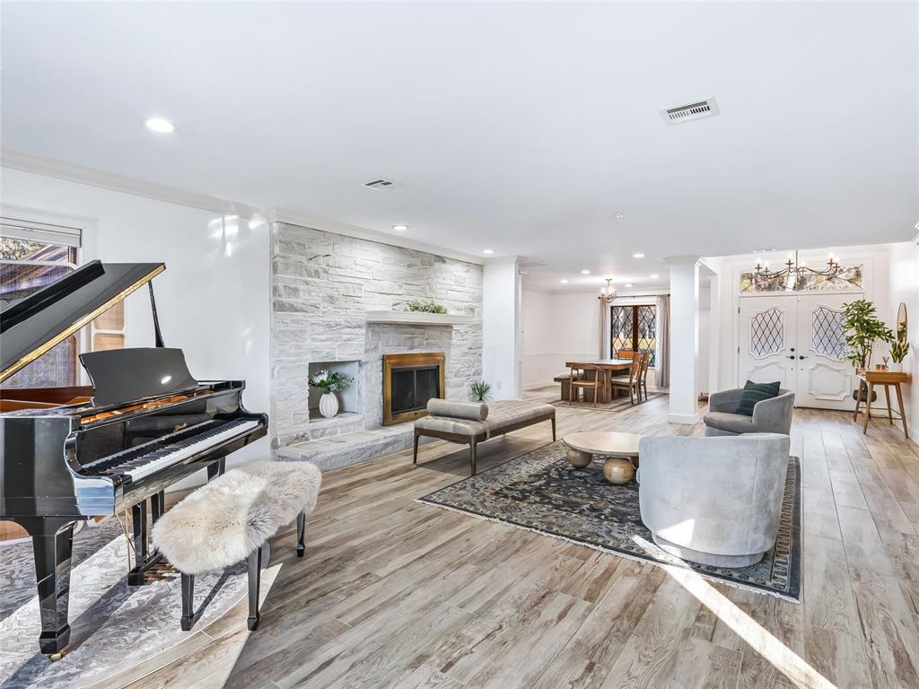680 Southeast 123rd Street Road Ocala, FL 34480 - Photo 9 of 48 a living room with furniture and a fireplace