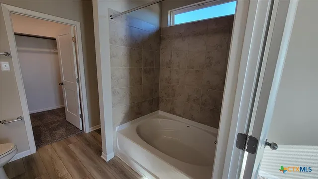 a bath tub sitting in a bathroom