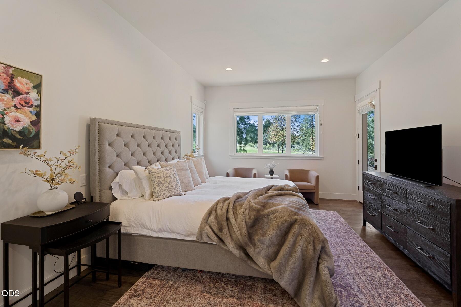 60255 Sunset View Drive Bend, OR 97702 - Photo 18 of 48 a bedroom with a bed and a flat screen tv