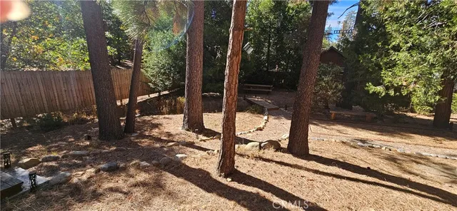 a view of a backyard of the house