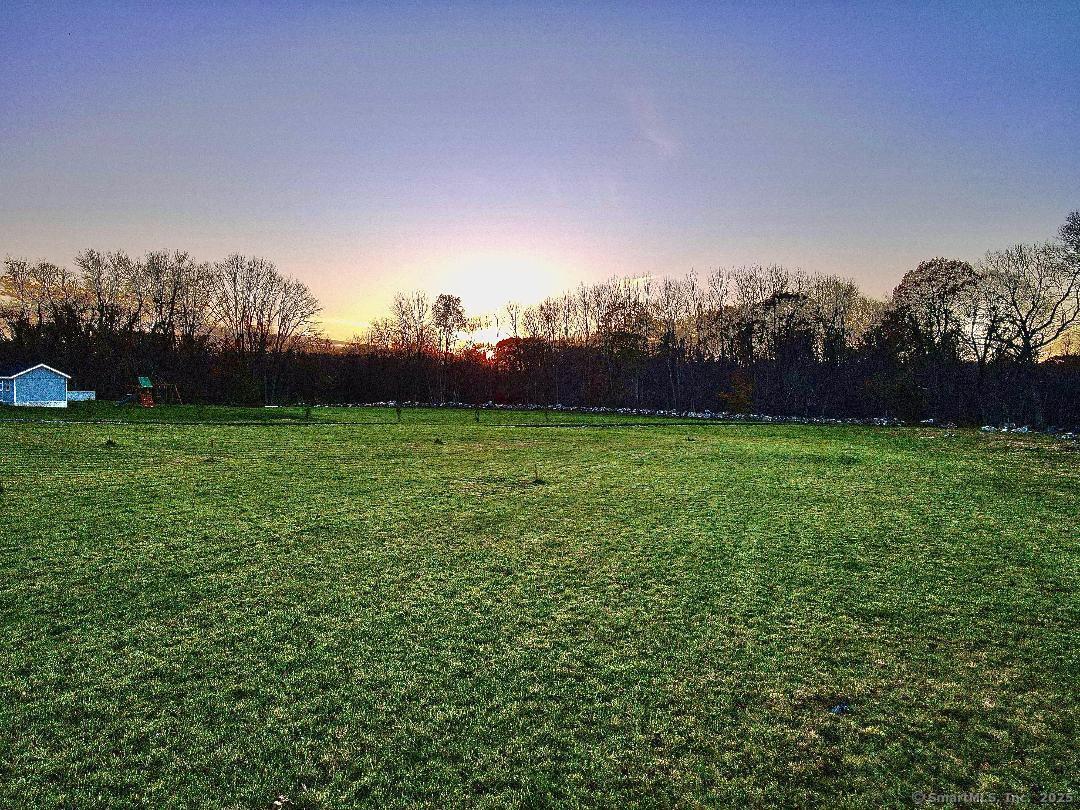 380 Scotland Road Norwich, CT 06360 - Photo 6 of 7 a view of a field of grass and trees