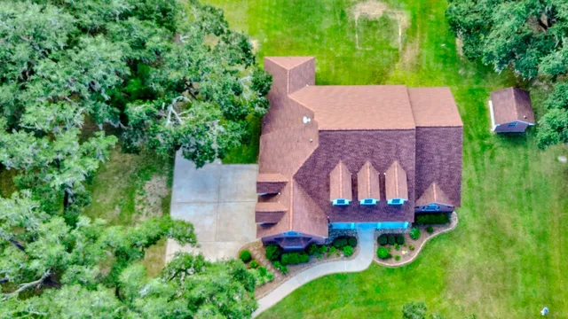 a front view of a house with a yard and front view