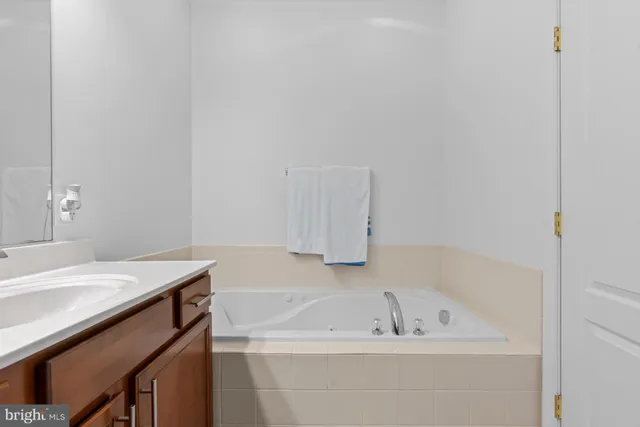 a bathroom with a sink a bath tub and a sink