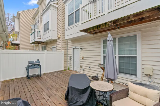 a balcony with table and chairs
