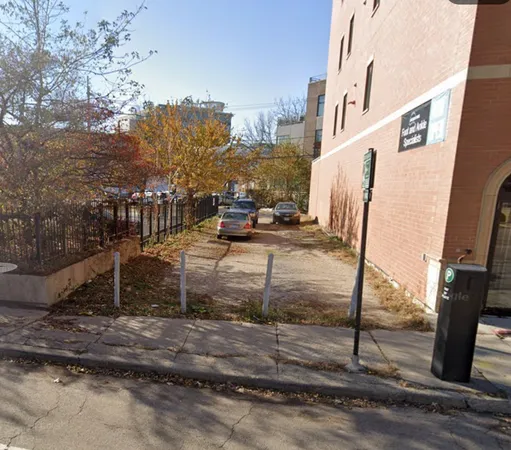 a view of a park with iron fence