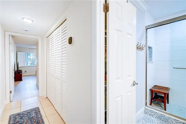 a room that has a bed and a window in it