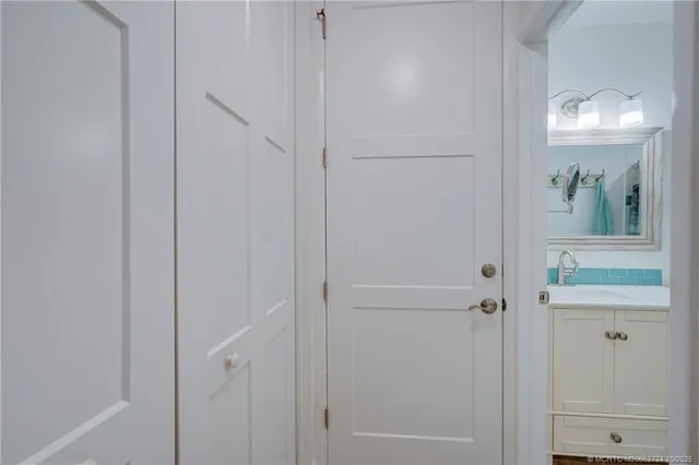 a kitchen with granite countertop a sink appliances cabinets and a counter top space