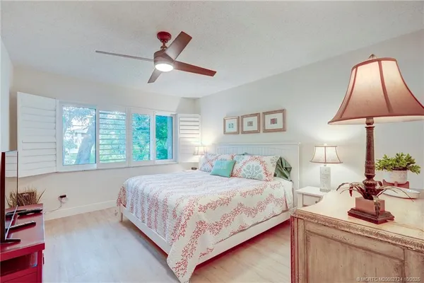 a kitchen with granite countertop white cabinets and a sink