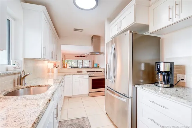 a view of a two chairs in the balcony