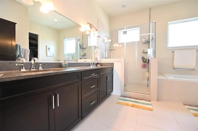 a kitchen with a sink and refrigerator