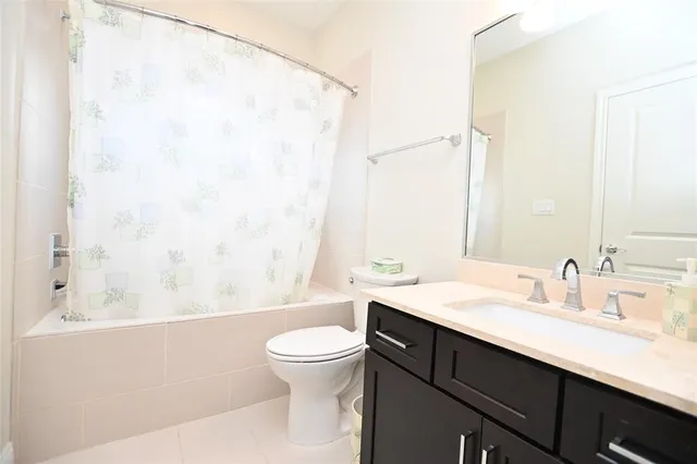 a bathroom with a sink a toilet and a bathtub