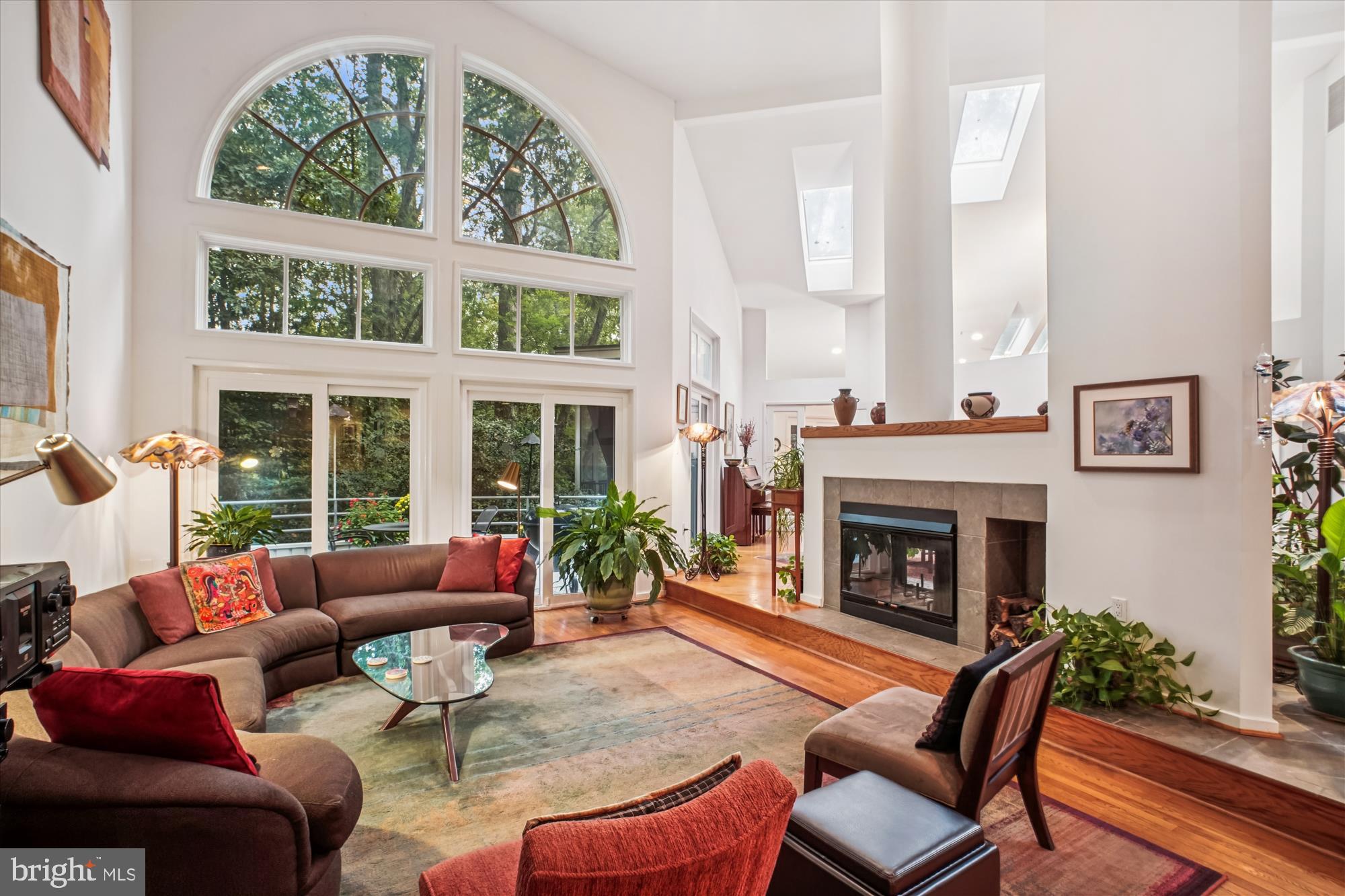 11590 Greenwich Point Road Reston, VA 20194 - Photo 8 of 52 a living room with furniture a fireplace and a large window